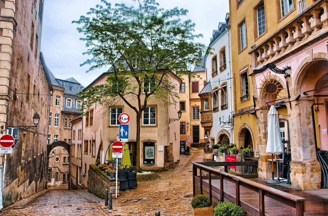 Narrow medieval street with cafes in Luxembourg city, Luxembourg.
