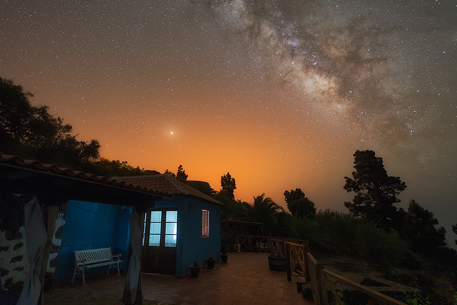 Stars and mars are visible in the night sky over an Airbnb listing.