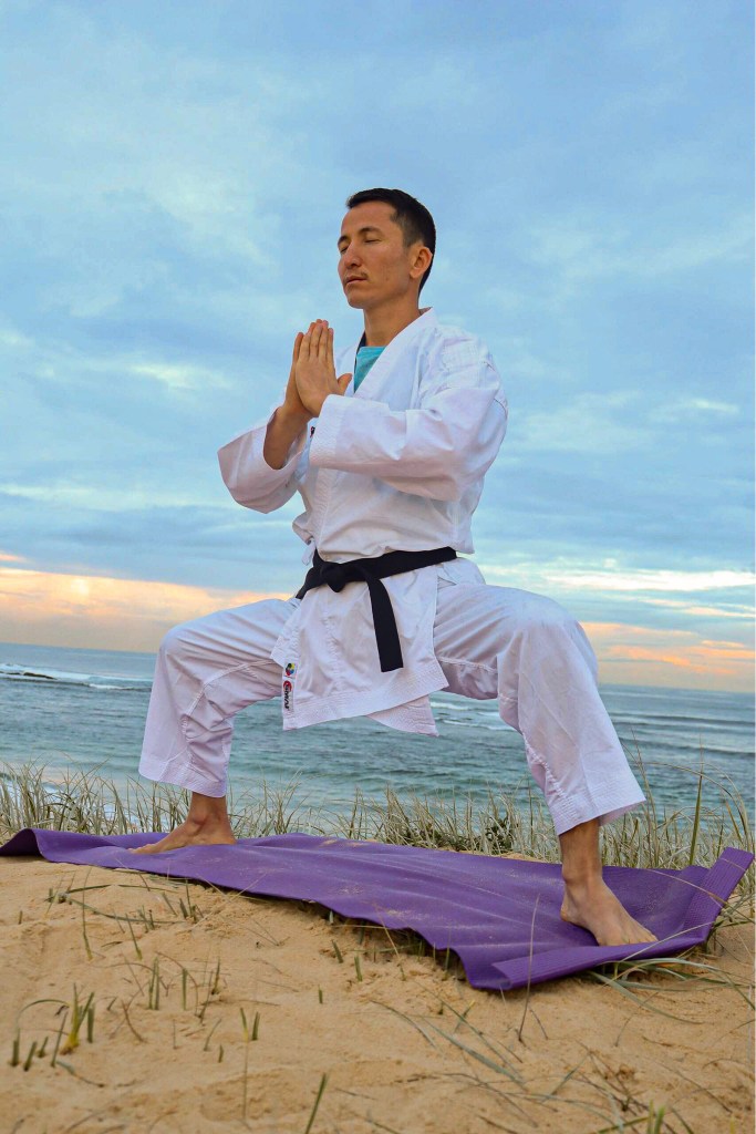 Asif Sultani training on a beach.