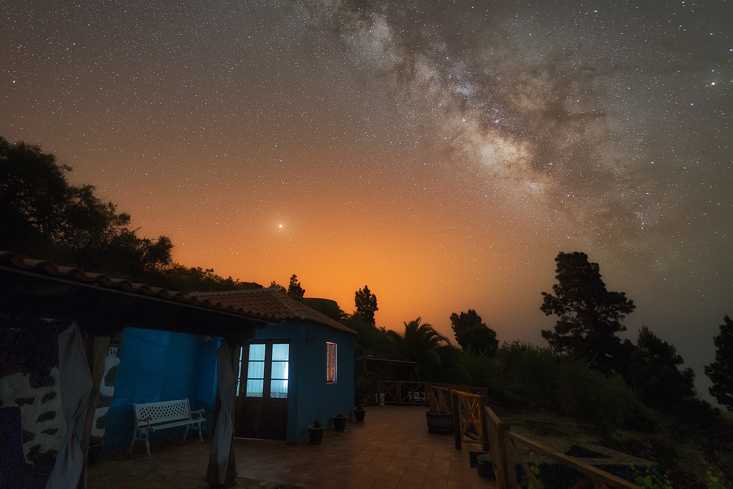 Stars and mars are visible in the night sky over an Airbnb listing.