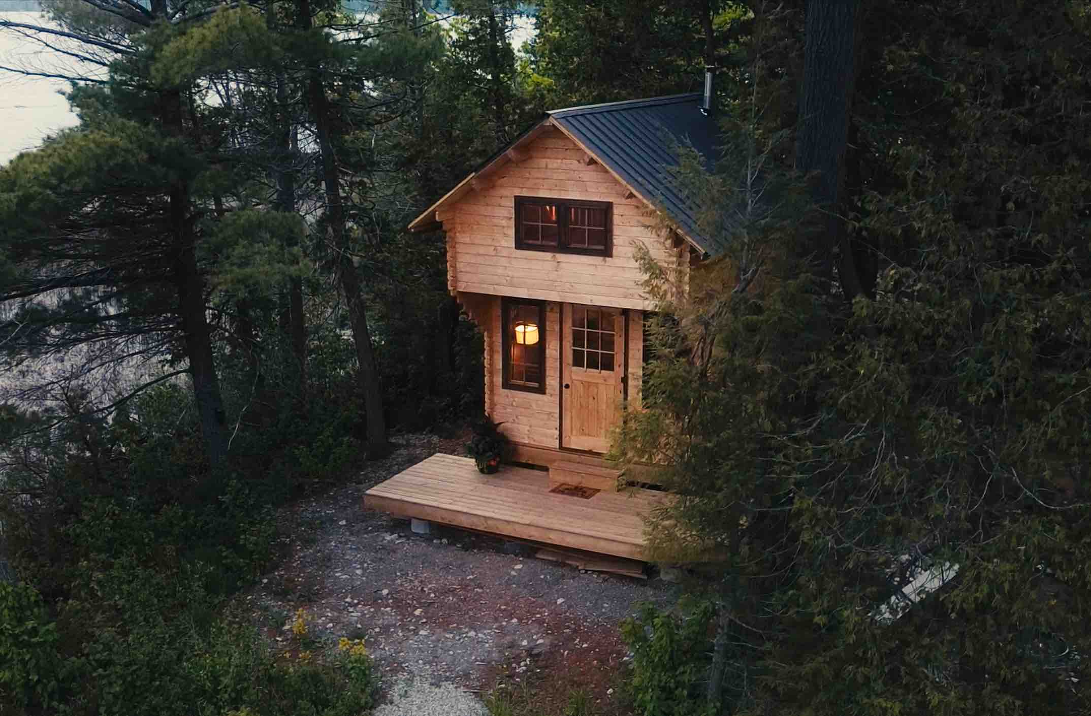 A wood cabin nestled amongst the trees.