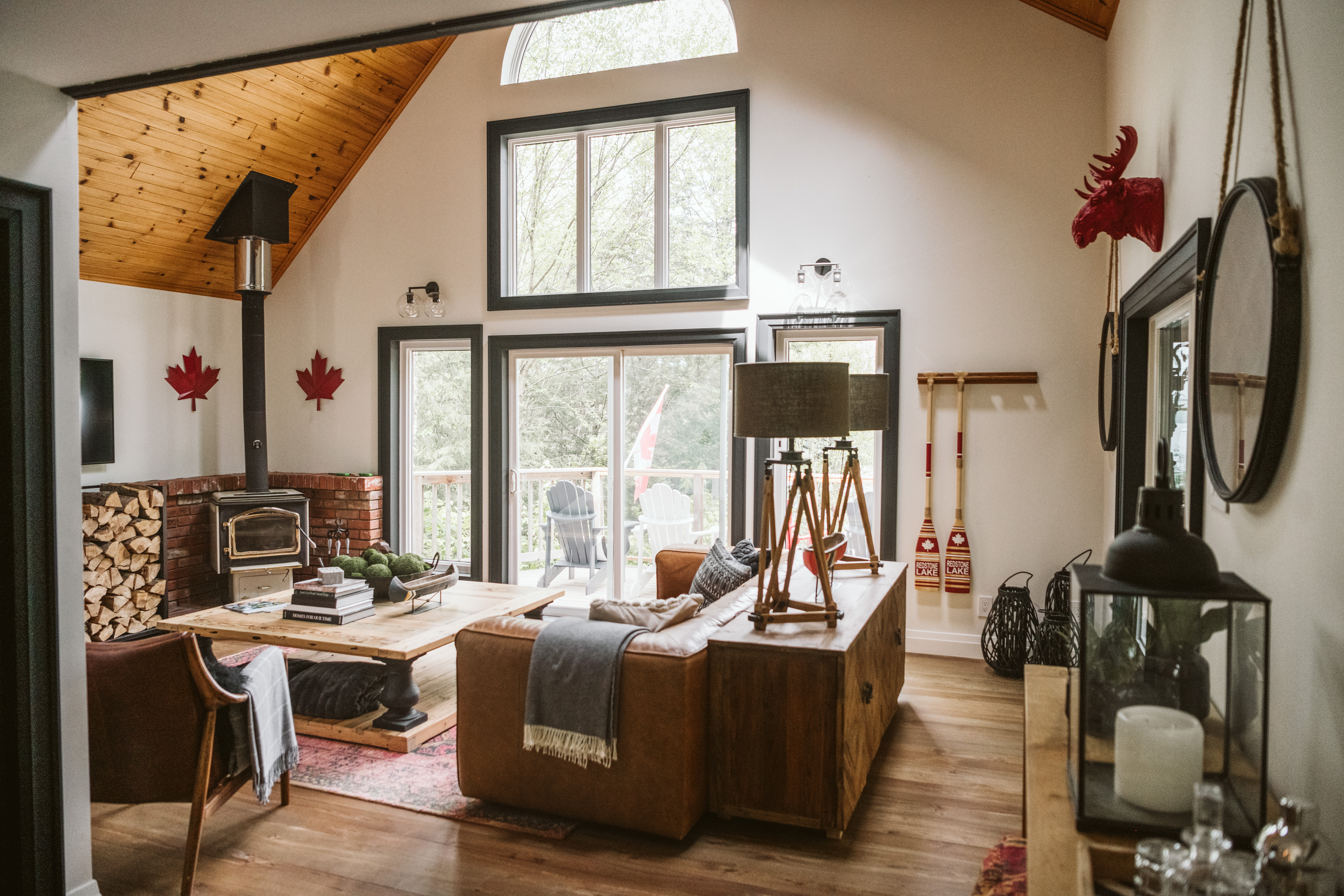 A sunny living room with Canadian decor sprinkled throughout.