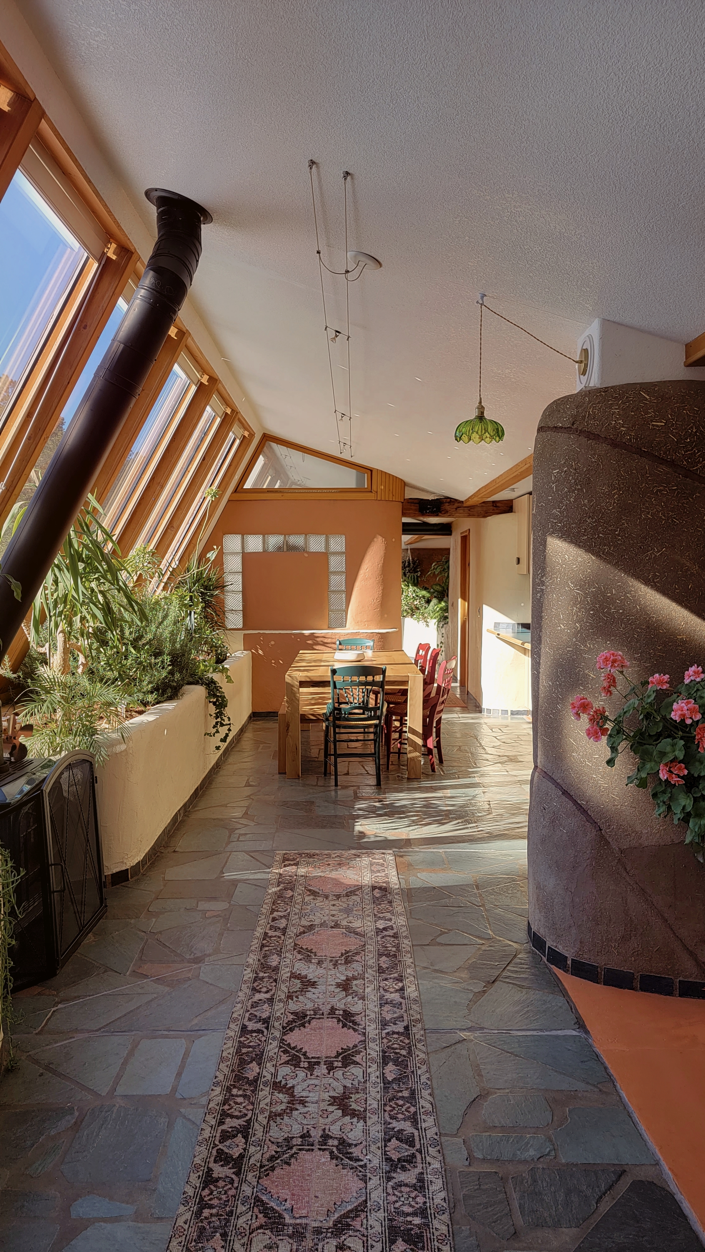 sunlit dining/common area in Earthen Home in the Forest