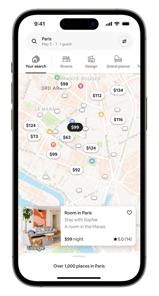 iPhone screen showing a view of the Airbnb app, displaying a map of stays with persistent pins when zooming and panning, and more results when searching.