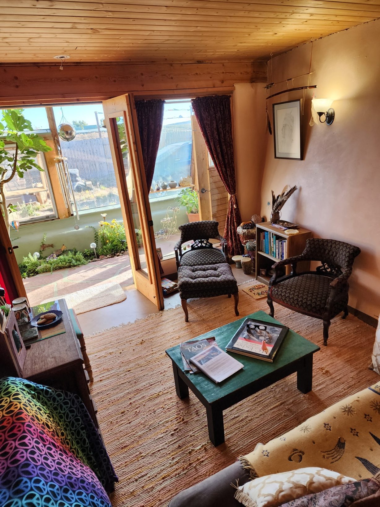 furnished interior of a room in the Peaceful Earthship Oasis