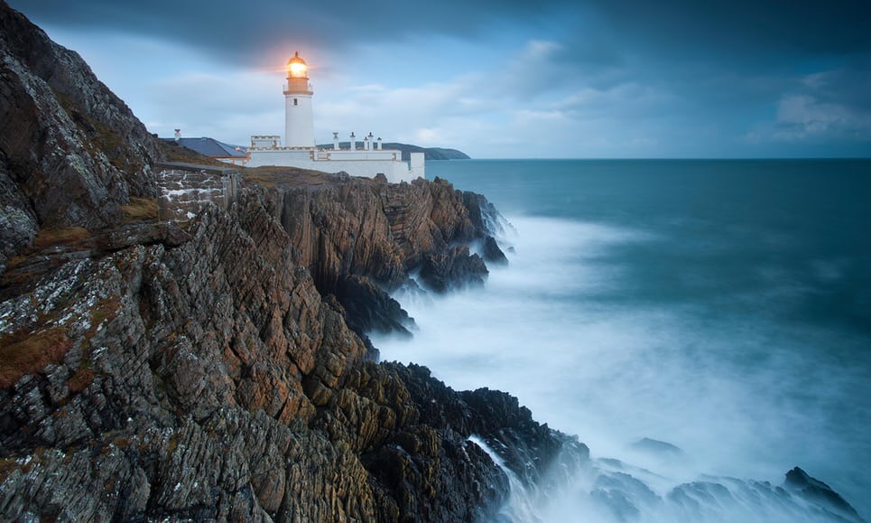 A cliffside lighthouse on the Isle of Man.
