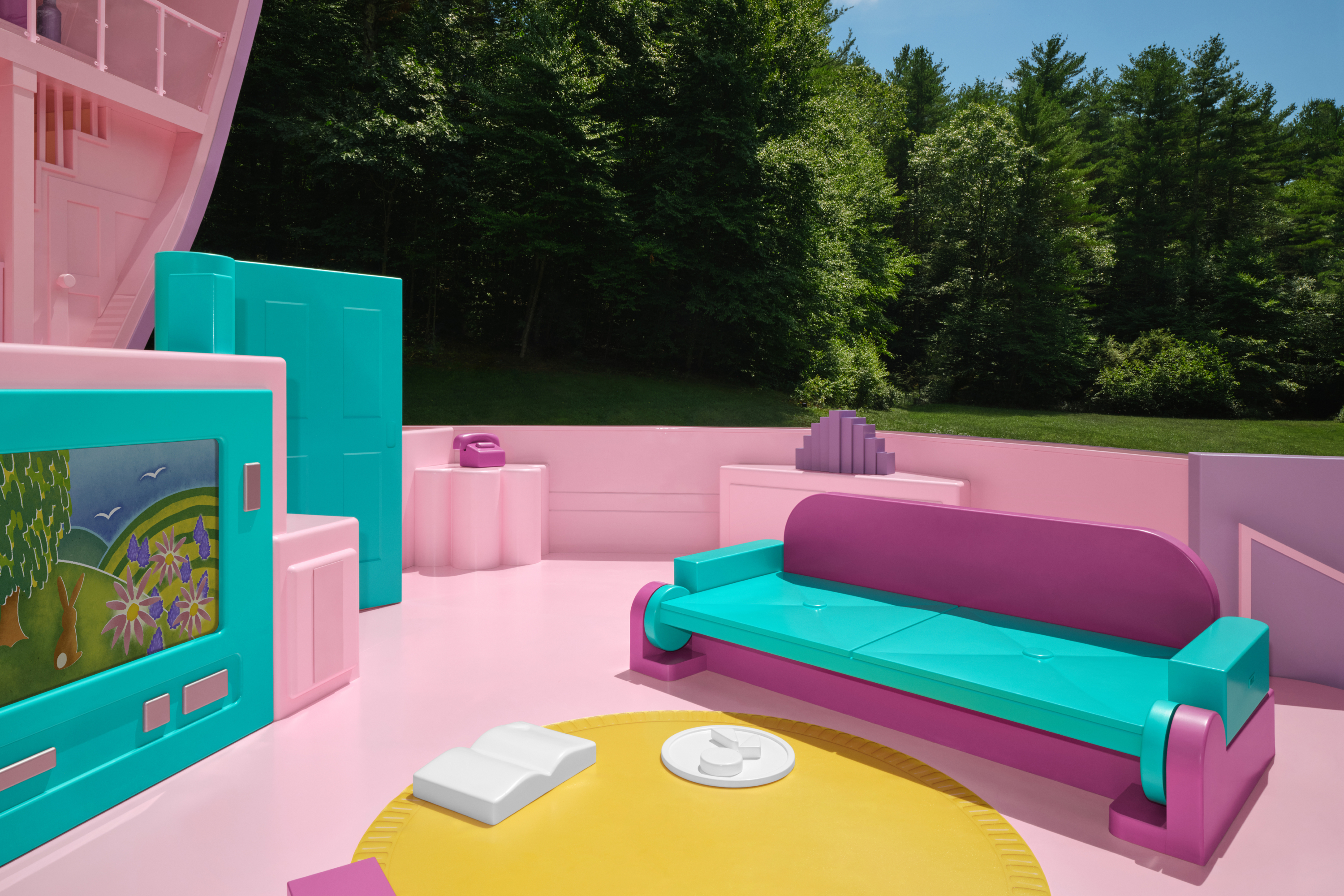 Polly Pocket's living room area with a pullout couch and plastic television.