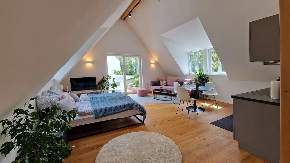 Bedroom with pointed ceiling