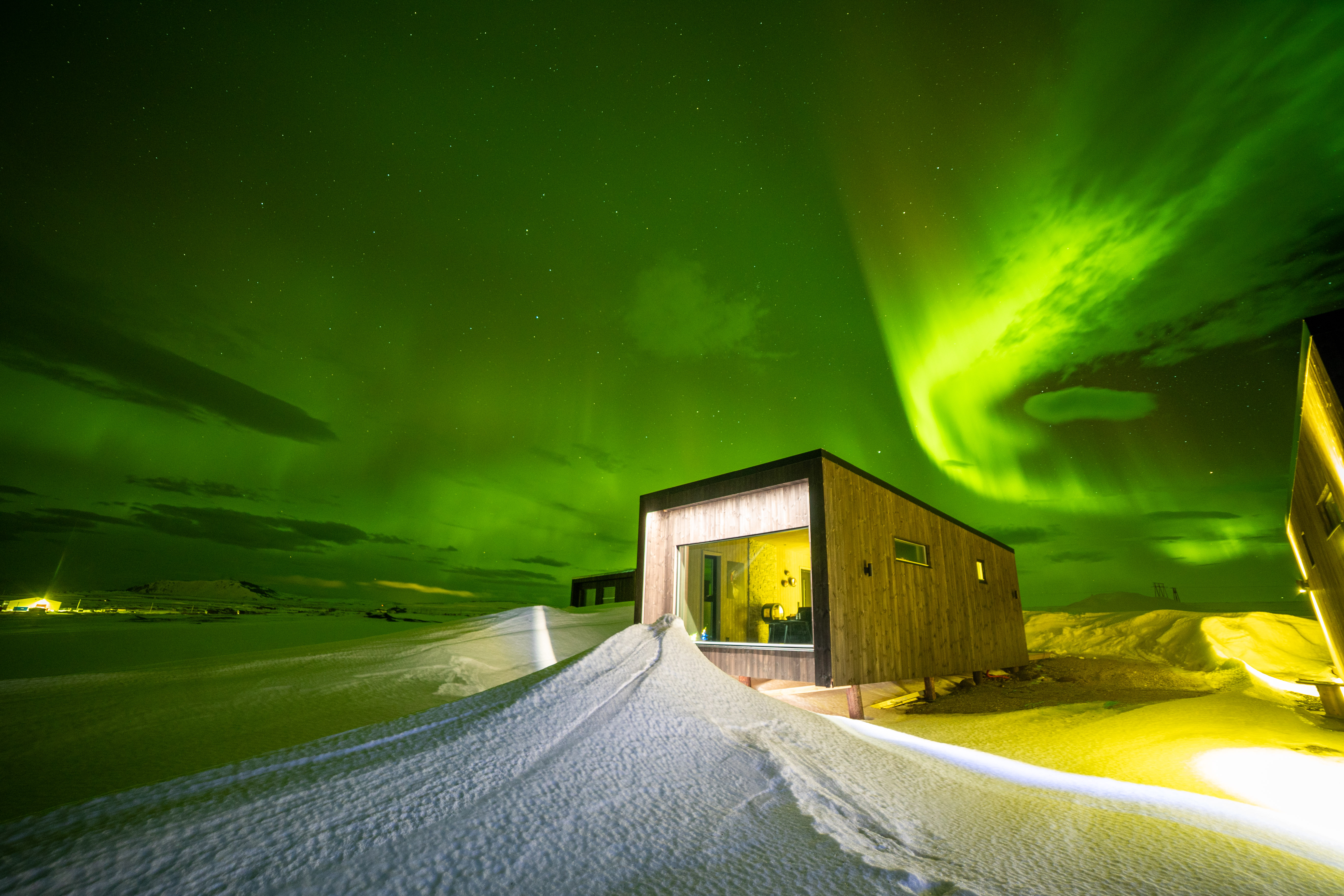 House with window with Northern Lights view