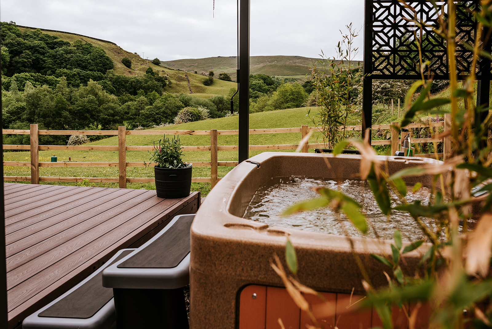 Hot tub with green landscaping in the background