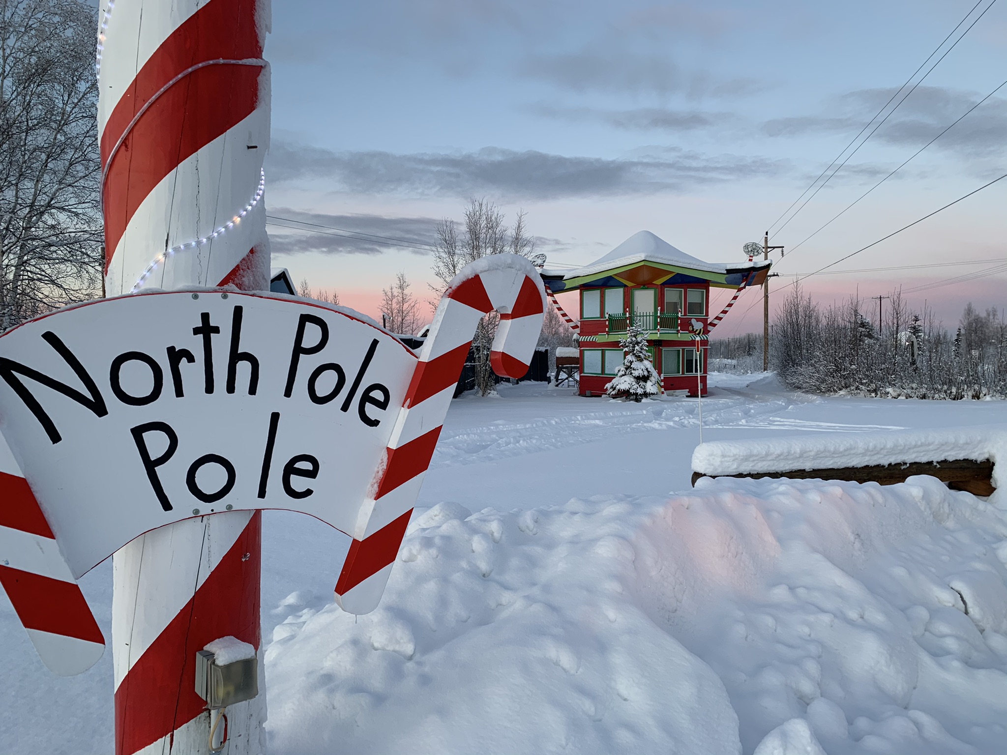 Small home with a North Pole sign