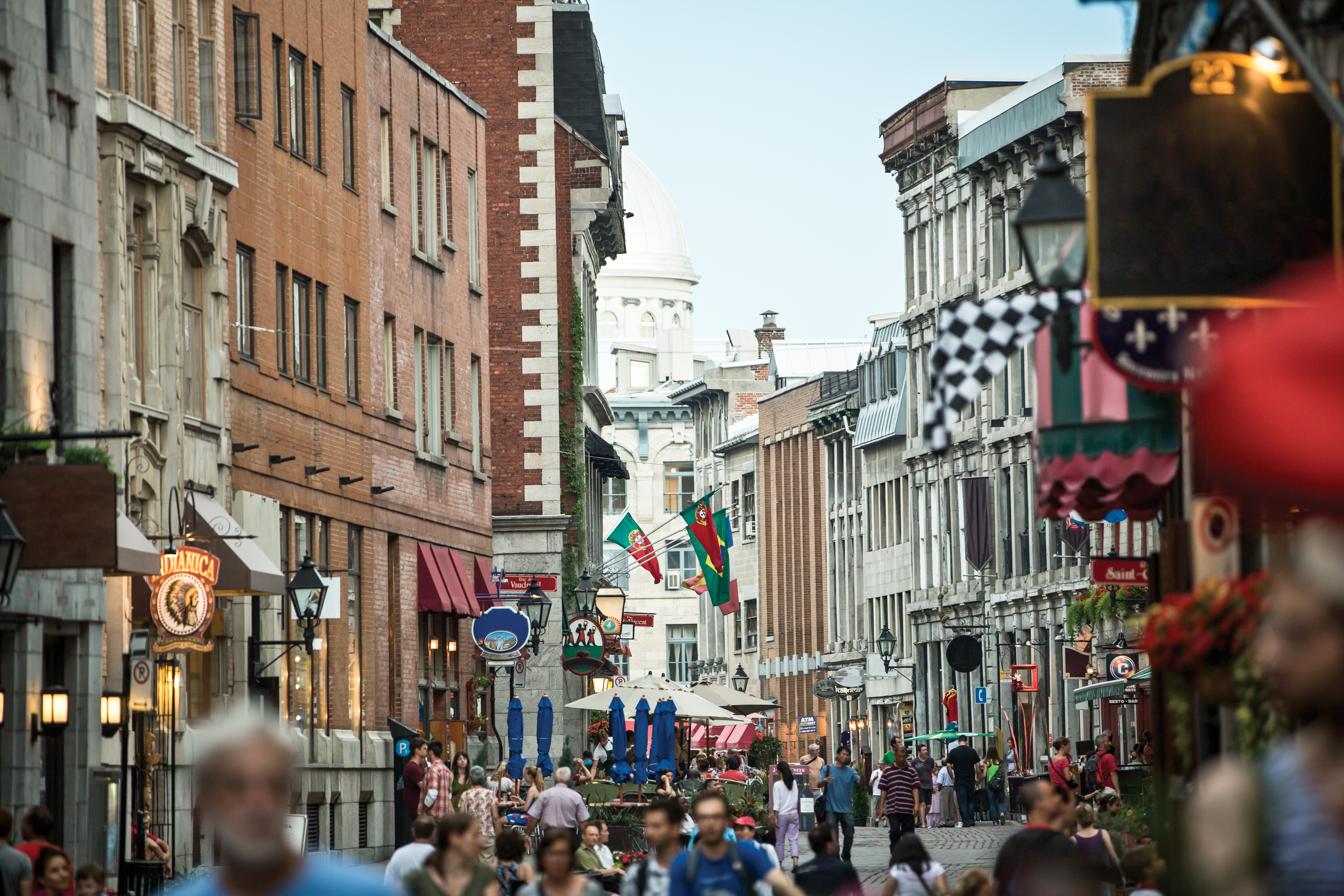 A crowd walking through the historic district in Old Montreal