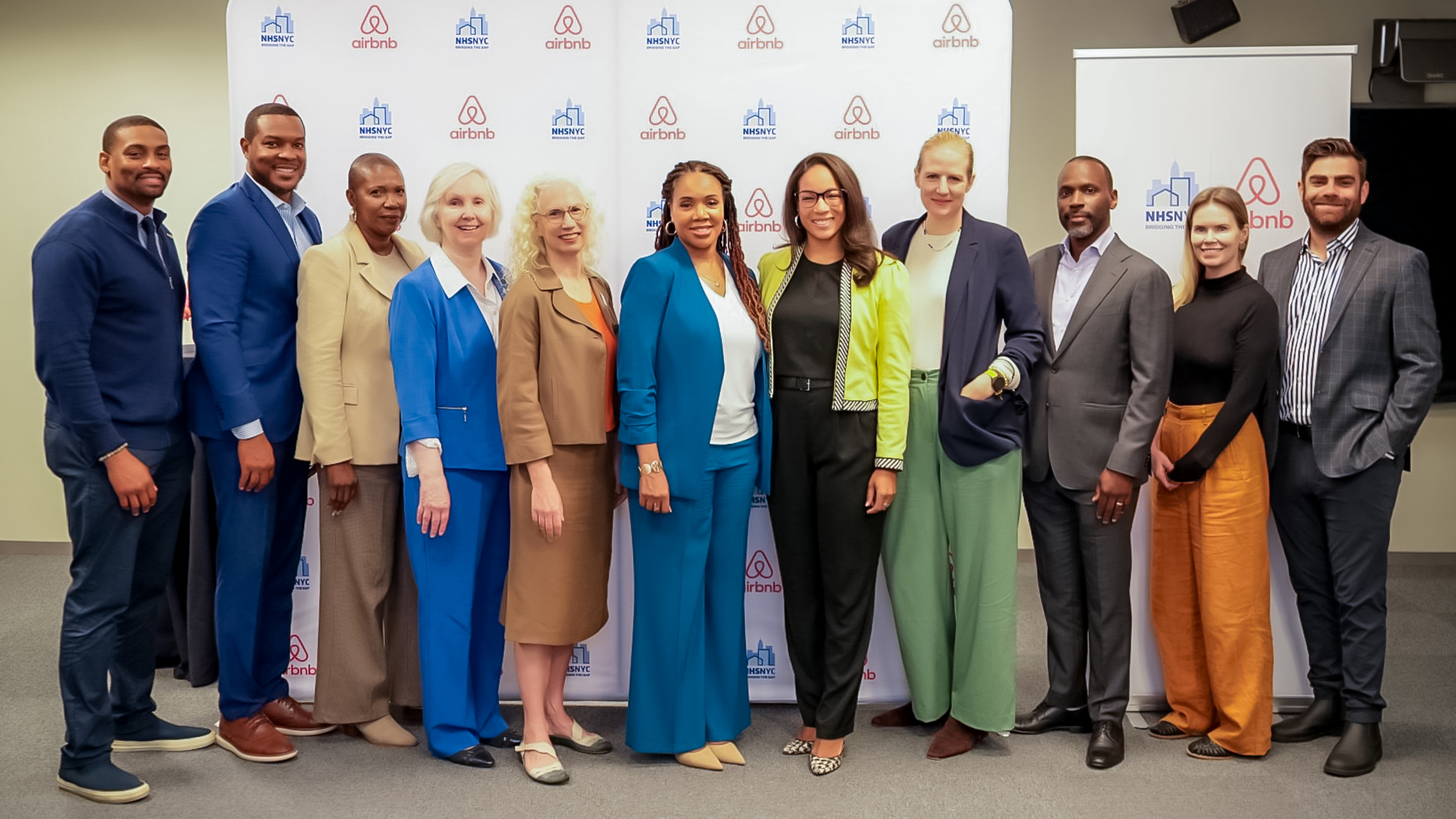 NHSNYC and Airbnb leadership on stage to announce their partnership